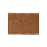 Handcrafted gold Chèvre leather card holder with a curved front card slot and white saddle stitching