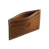 Atelier Tamago handmade gold leather card holder featuring fine grain texture and contrasting white stitching